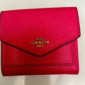 Coach trifold wallet.